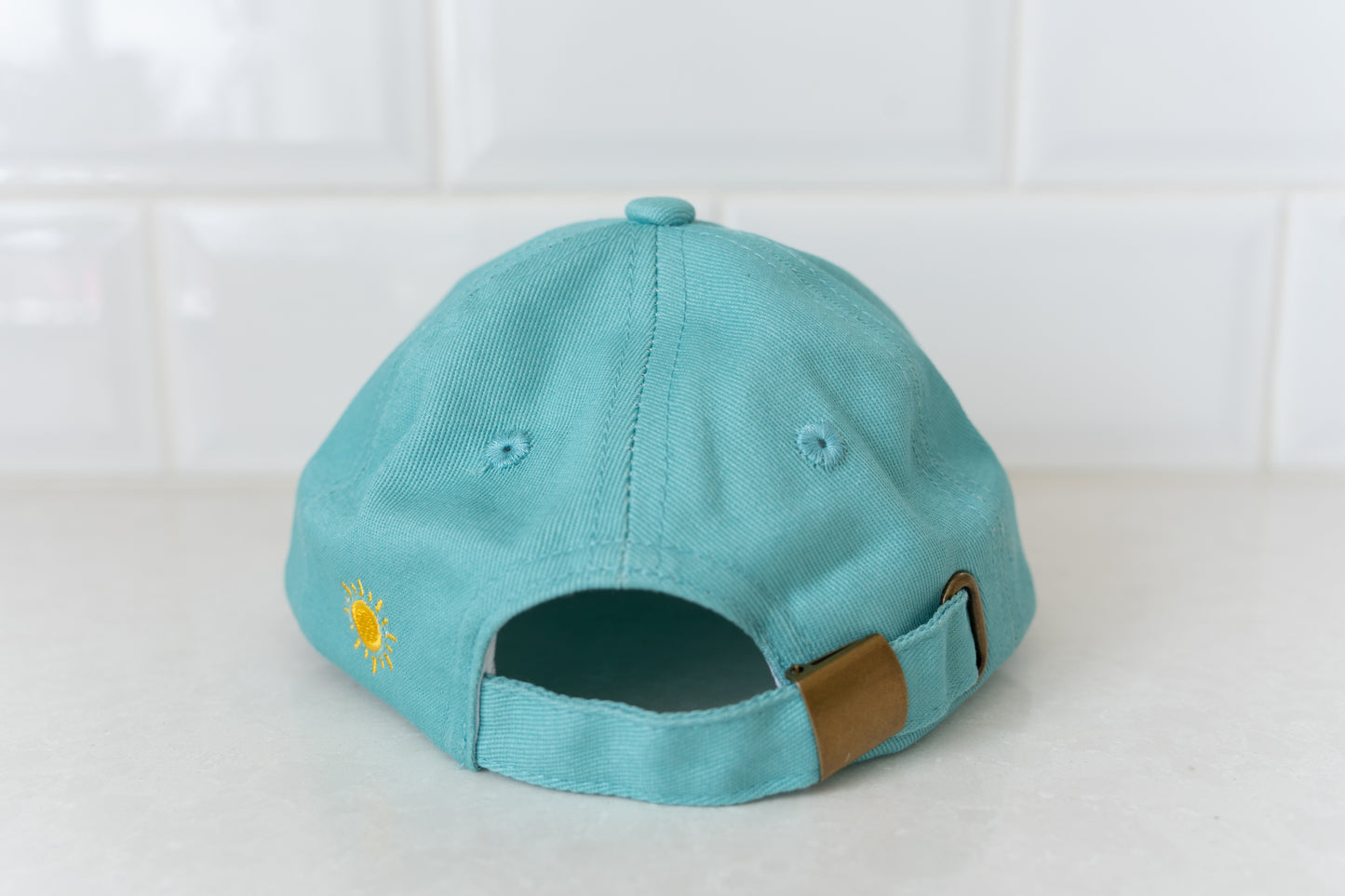 Kids' cap featuring 'Free Range Kid' slogan, great for little explorers and outdoor play.
