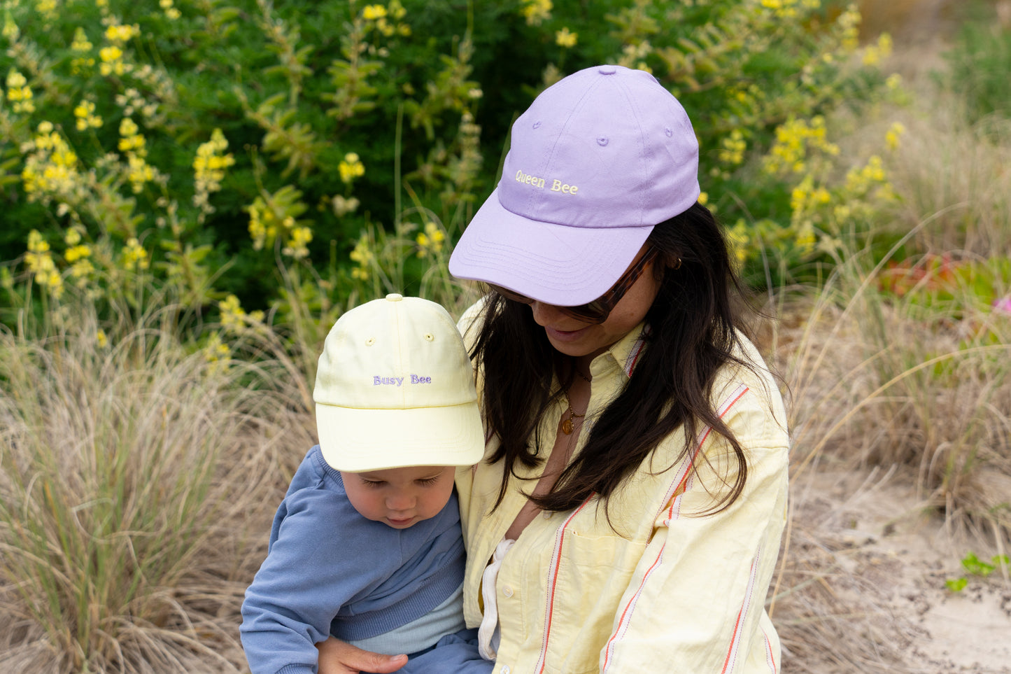 Matching 'Busy Bee' kids' hat and 'Queen Bee' mums' hat, ideal for stylish mother and child moments outdoors.