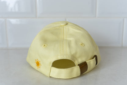 Yellow 'Busy Bee' hat for kids, combining sun safety with a playful design.
