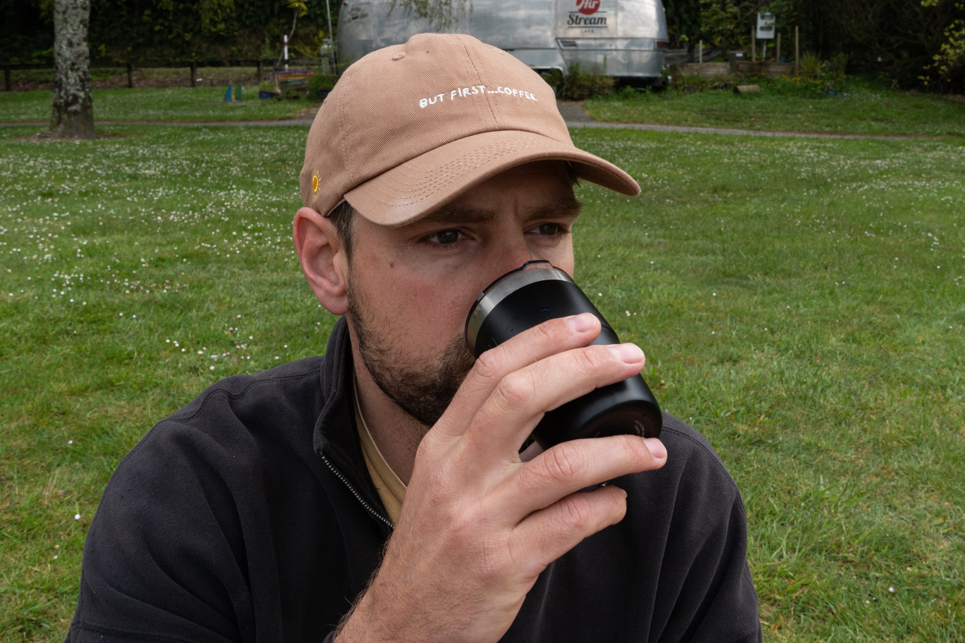Brown 'But First, Coffee' cap for caffeine lovers, minimalist design on a dad hat style.