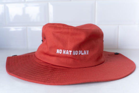 Adult bucket hat in red with 'No Hat No Play' slogan, perfect for sun protection during outdoor activities.