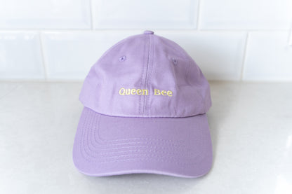Stylish 'Queen Bee' hat for mums, perfect for adding a touch of fun and personality to casual outfits.