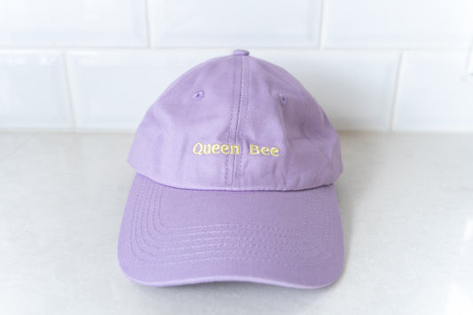 Stylish 'Queen Bee' hat for mums, perfect for adding a touch of fun and personality to casual outfits.